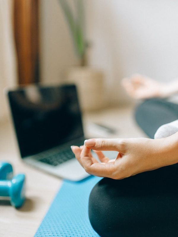 Spacious, well-lit room with a yoga mat on the floor.